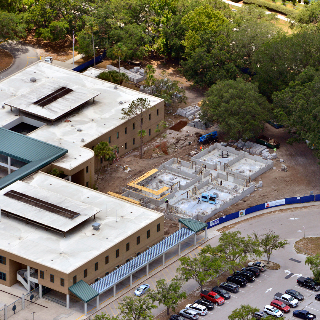 school construction progress with exterior and interior build phases