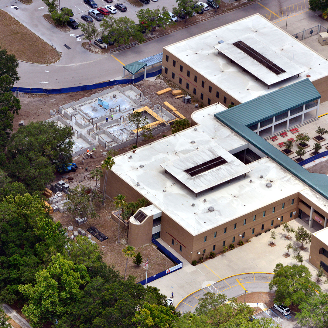 school construction progress with exterior and interior build phases