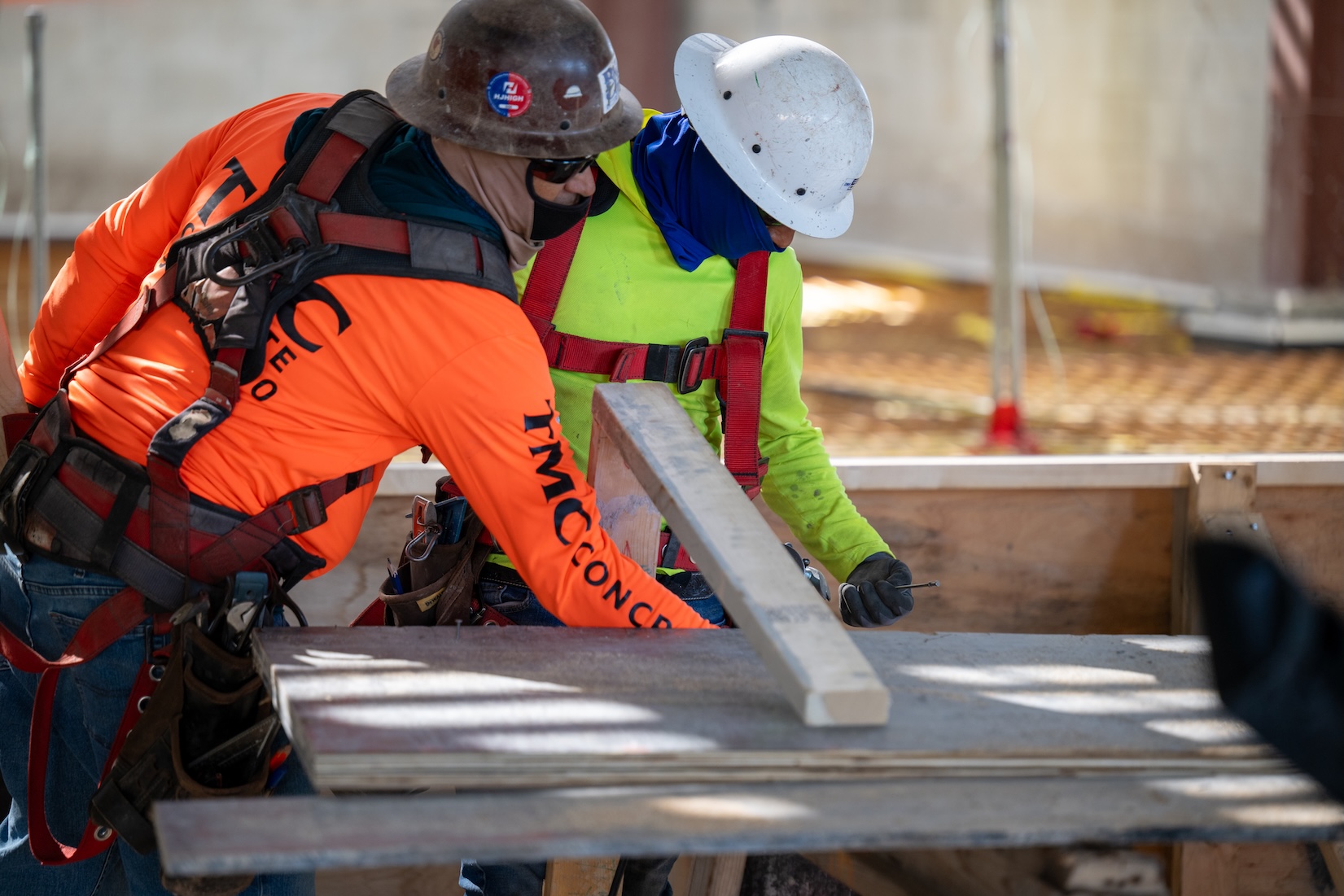 construction team working on structural steel and concrete development